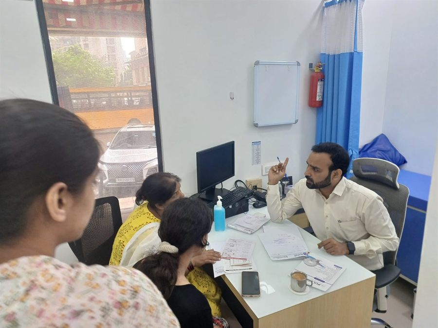 Staff and visitors at a camp registration desk