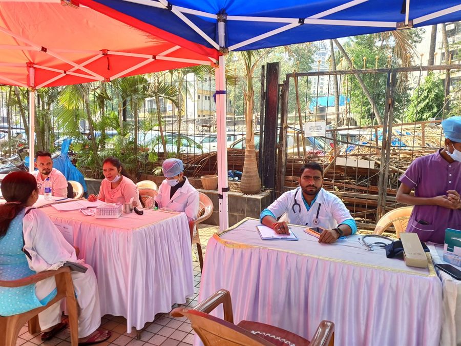 Staff attending to visitors at an outdoor camp