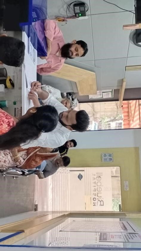Staff member attending to a visitor in a treatment room