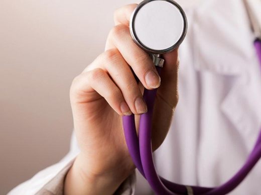 Doctor with a stethoscope at a Bluebell Hospital outreach camp